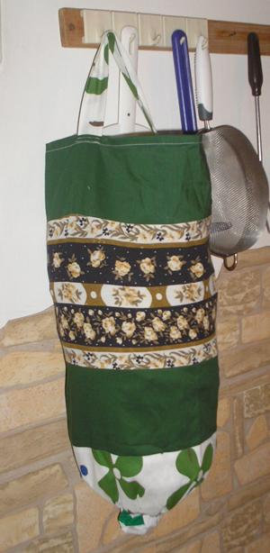 nejlonzacskó-tartó